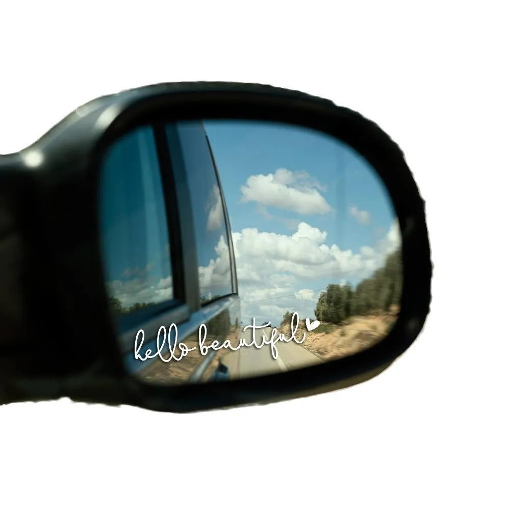 Plastic rearview mirror sticker 10x3cm in black on a car mirror