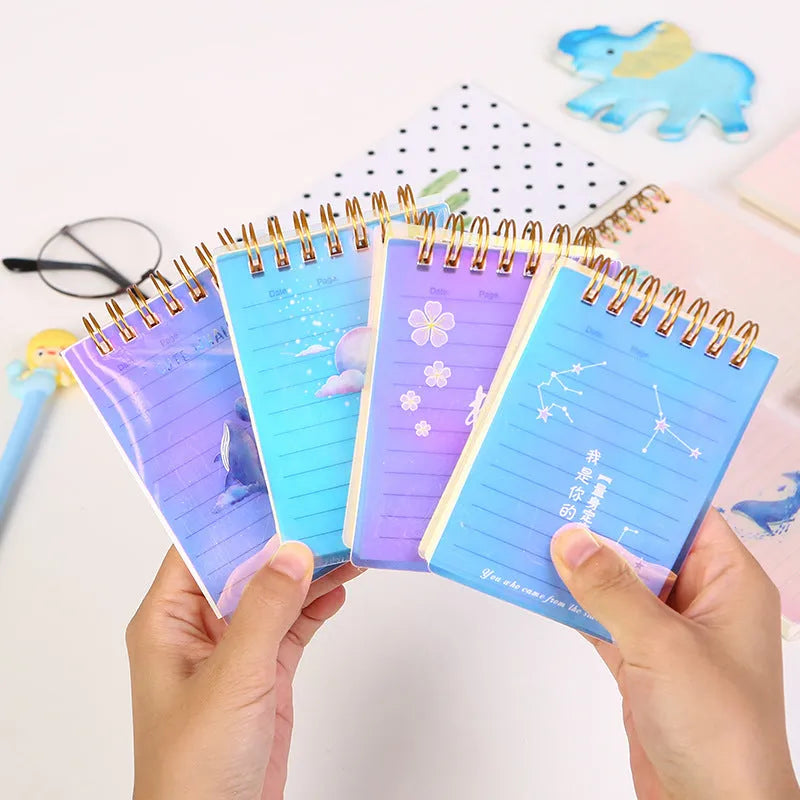 A7 rollover coil pocket notebook in four colours with spiral binding and PP cover