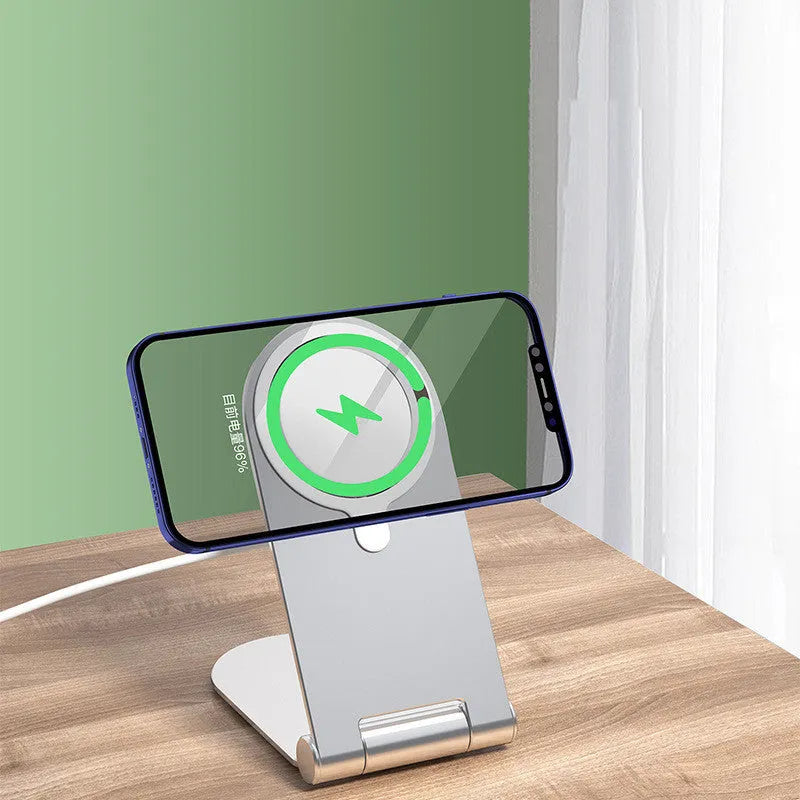 Silver adjustable magnetic phone bracket for iPhone 12 shown in a compact, portable design.