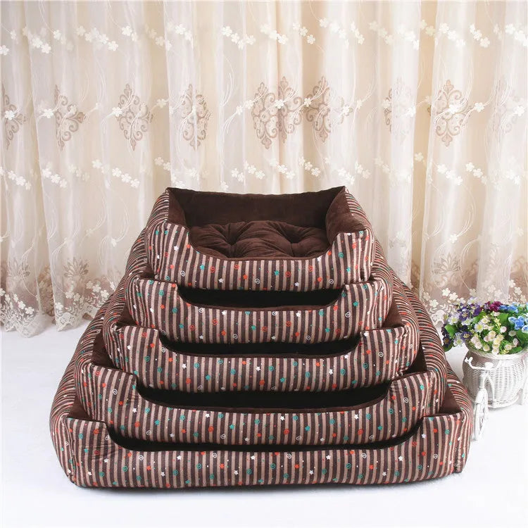 A grey and white striped bolster-sided pet bed for dogs or cats with a removable cloth cover.