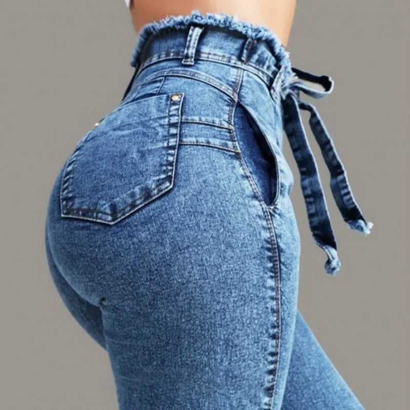 Cowboy fabric fringed jeans in dark blue, grey, or light blue on a model.
