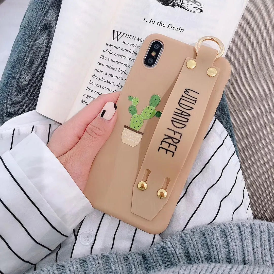 Green graffiti design wristband holder phone case for iPhone showing integrated strap and precise port cutouts