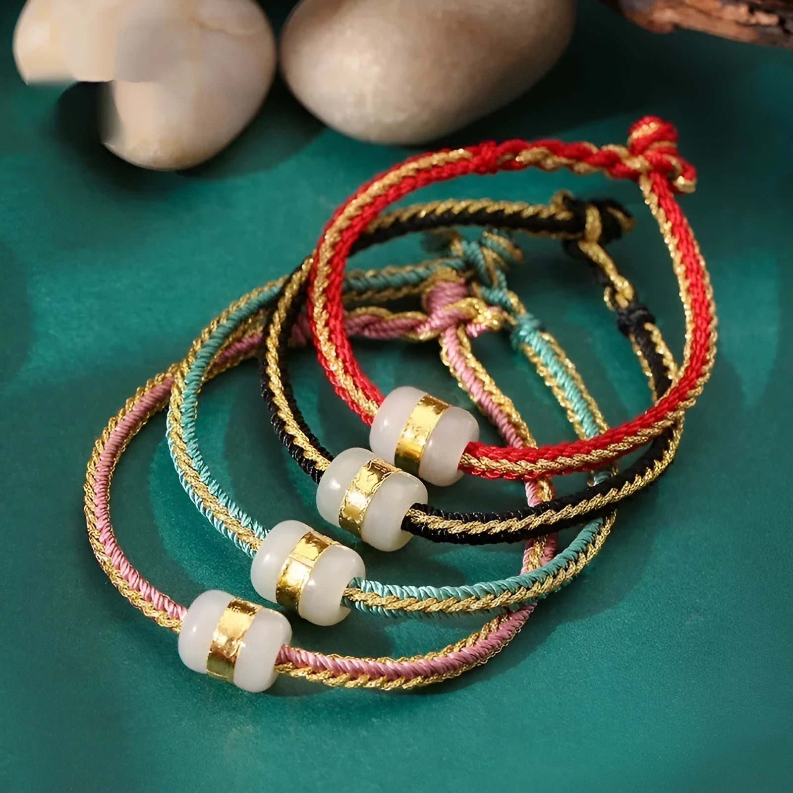 Hand-woven bracelet with Hetian jade inlay gold tone finish geometric shape on dark background