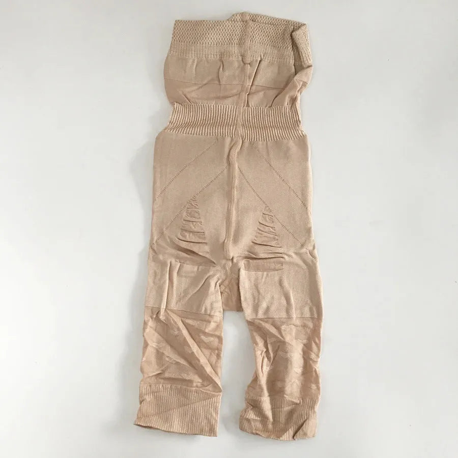 Black high-waist seamless shapewear shorts laid flat showing the waistband and short length.