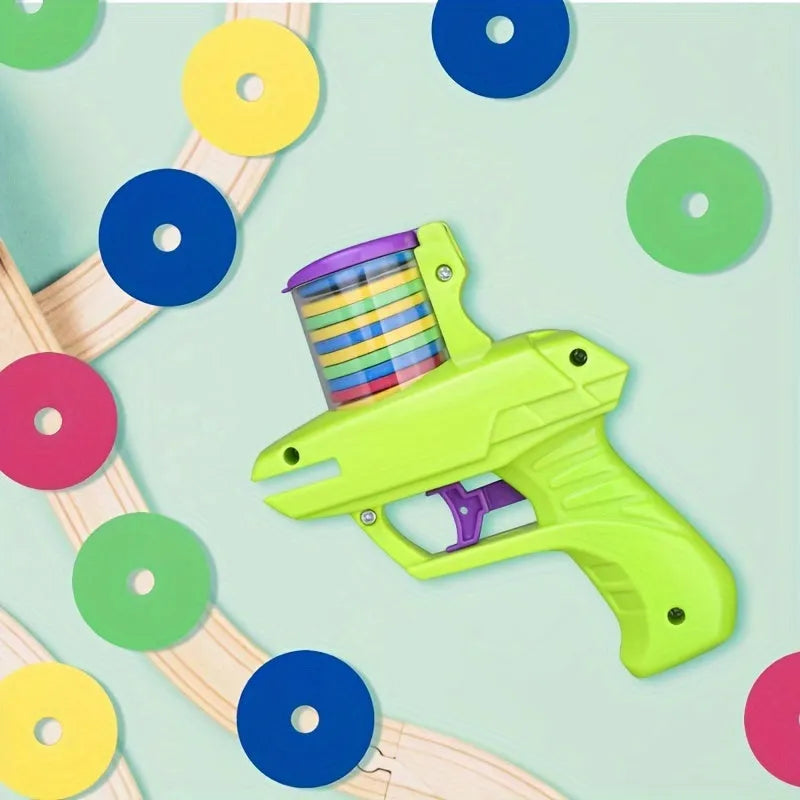 Green and purple durable plastic cat toy launcher with foam discs for battery-free interactive play