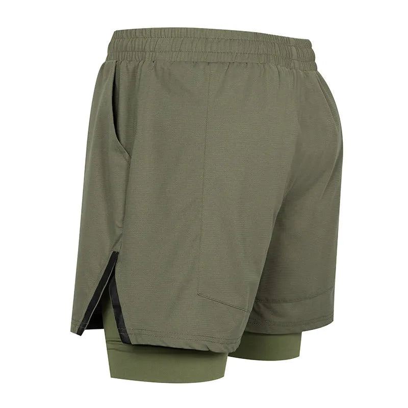 Man wearing quick-drying plaid sports shorts in army green, showing mid waist and shorts length.
