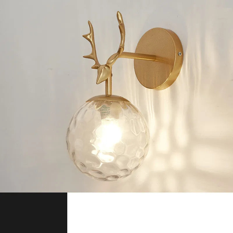 Modern round glass wall sconce with a Nordic design, mounted on a white wall, showing its light-diffusing shade and compact 30cm diameter.