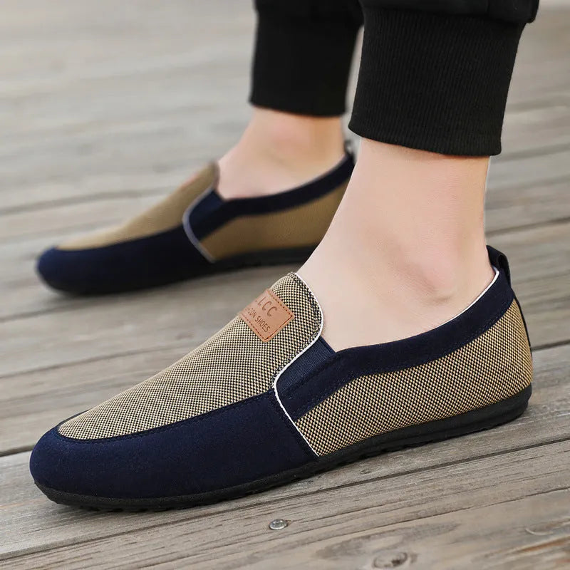 Men's grey and khaki canvas board shoes with round toe and rubber sole.