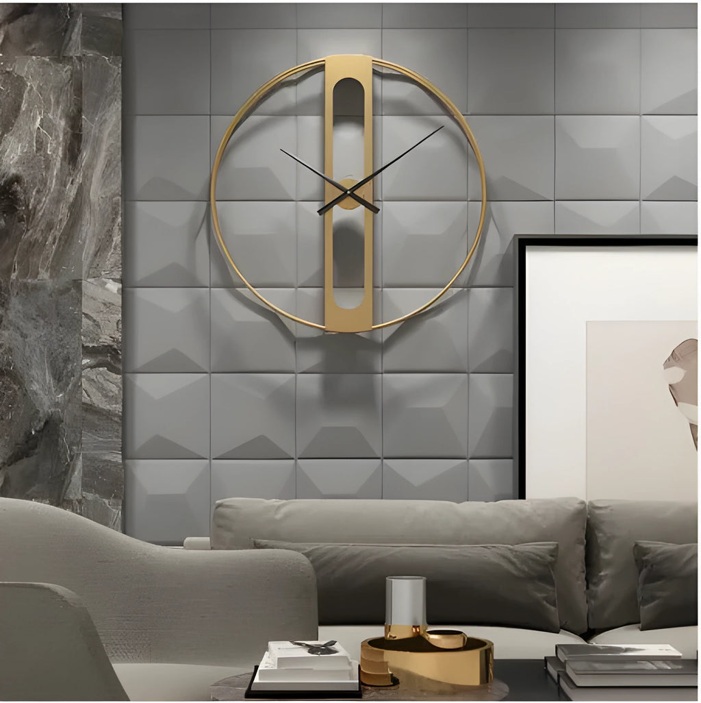 Large round metal wall clock with Roman numerals on a white wall.