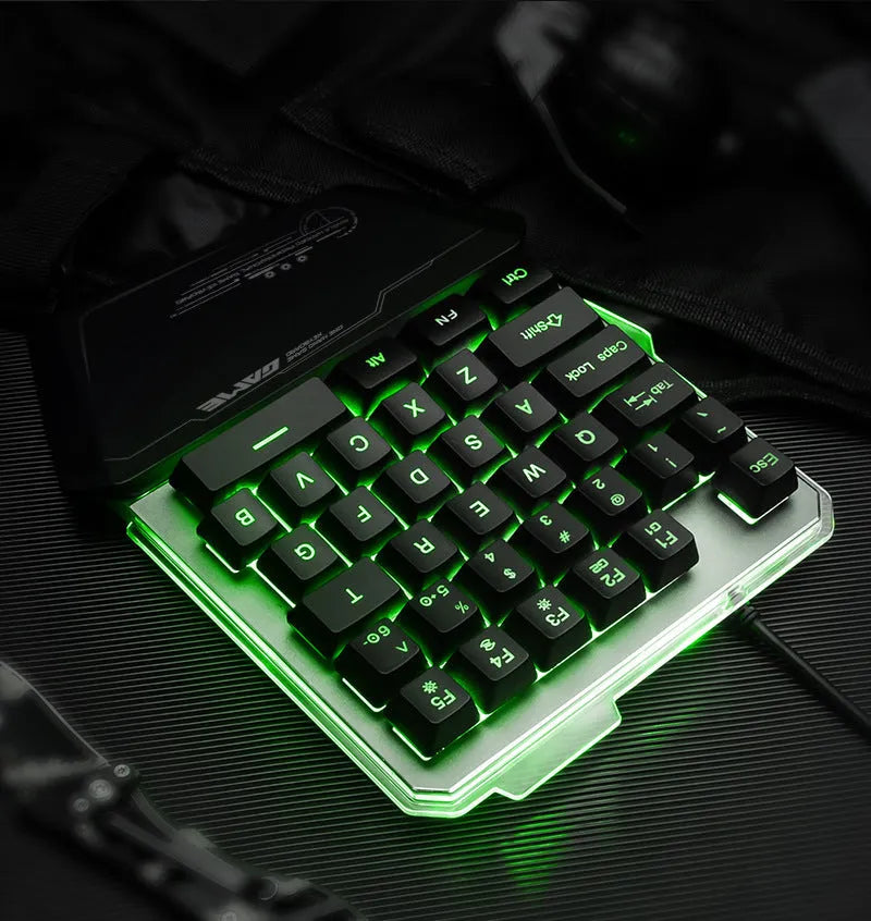 Black G40 Flow one-handed robotic gaming keyboard with RGB backlit keys on a desk.