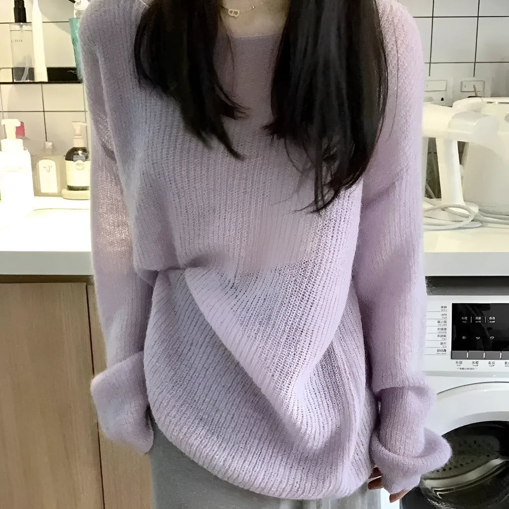 Purple sleeveless women's blouse with hollow out detail and round neck, made from ice silk fabric.
