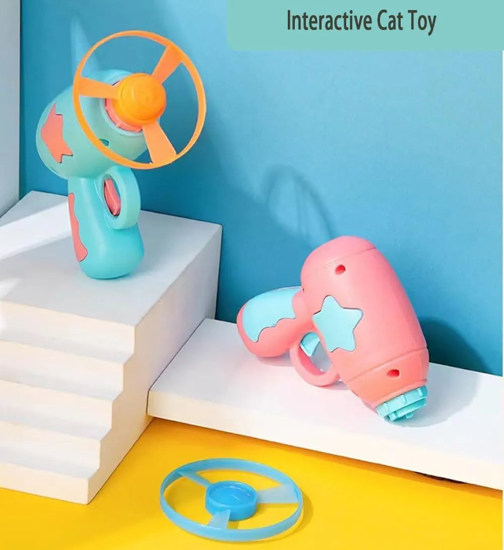 Blue plastic cat toy gun with spinning Frisbee launcher for indoor cats