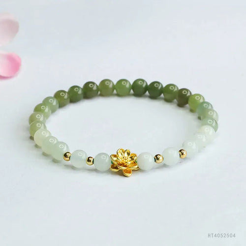 Hand-woven Chinese jade bracelet with water-gradient colour pattern and flower design