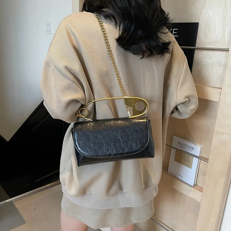 Creative paper clip design PU leather shoulder handbag in horizontal square shape with sandwich pocket