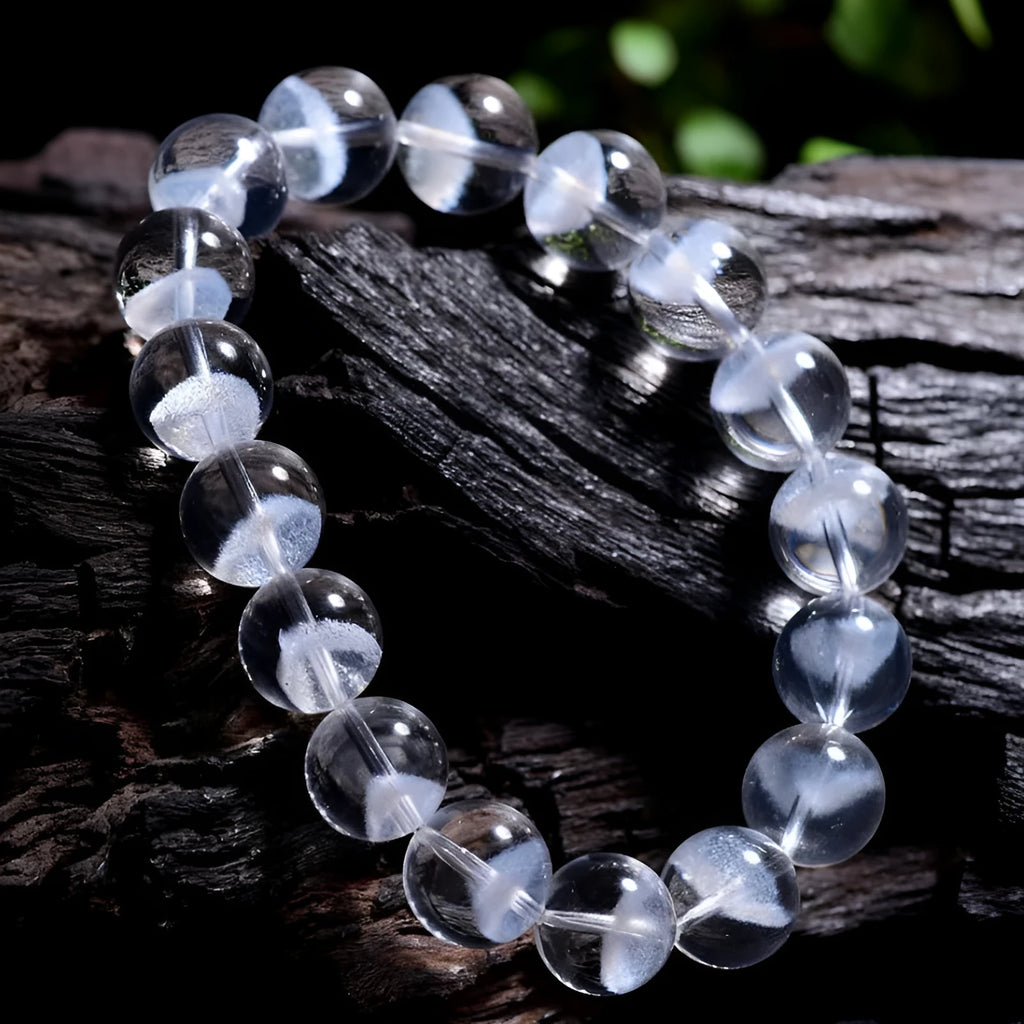 Women's original white crystal pyramid bracelet with ruyi charm, showing polished beads.