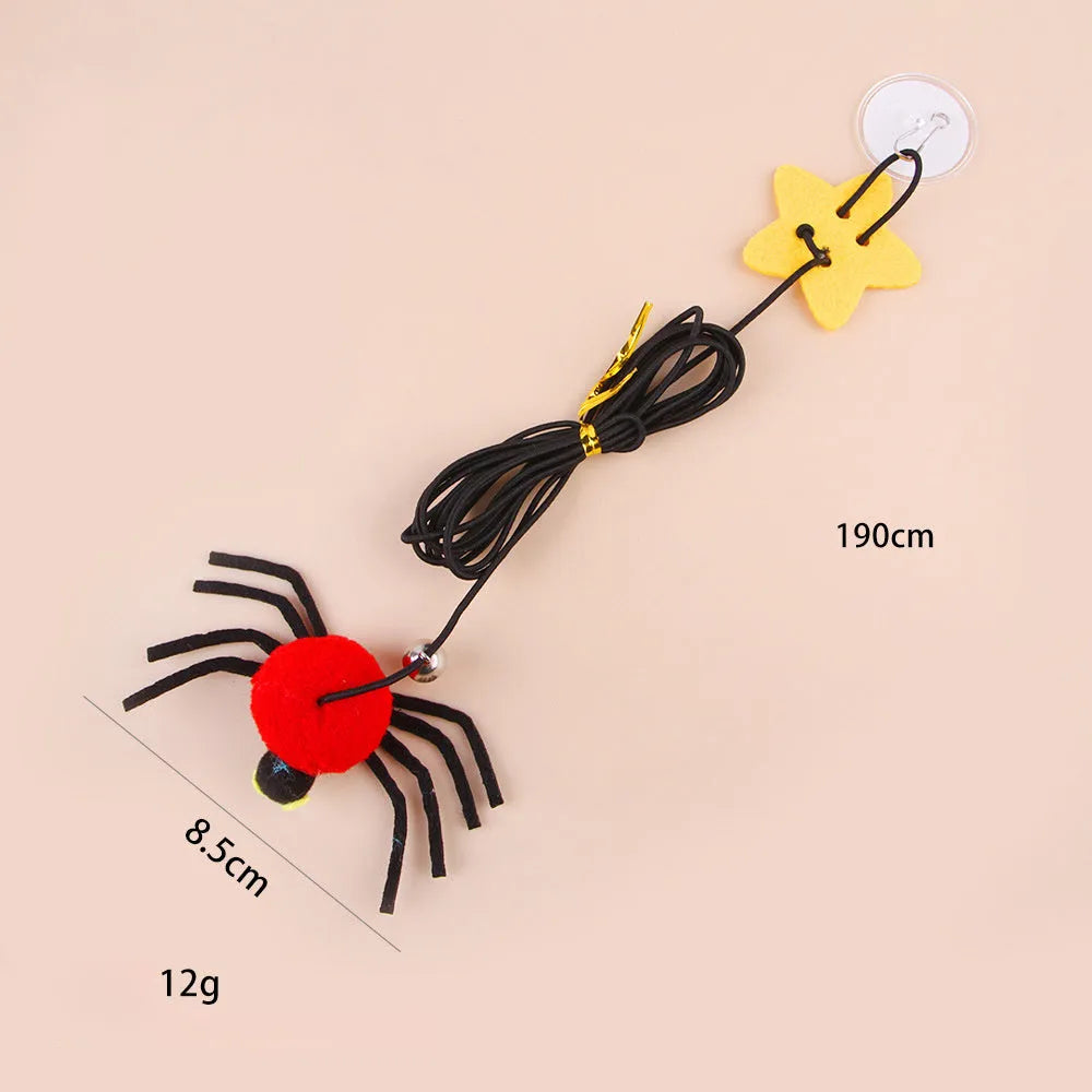 Red or yellow cat toy hanging from door with elastic rope, feathers, bells and spider attachment