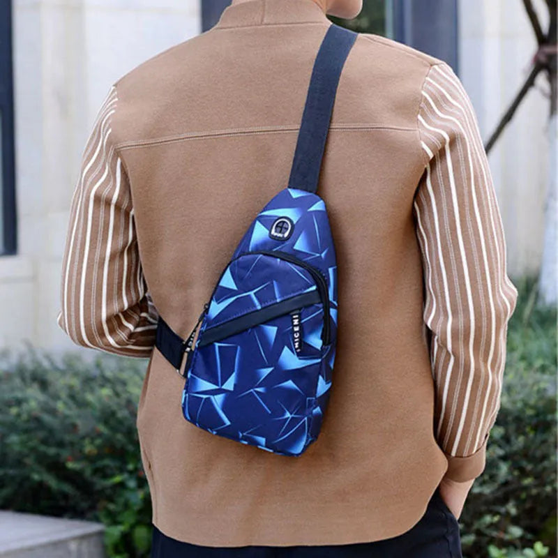 Men's blue crossbody sling bag with an earphone hole and zipper pocket.