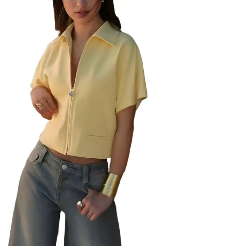 Loose-fit short-sleeve polyester casual top on a hanger, shown in white, black, and yellow colour options.