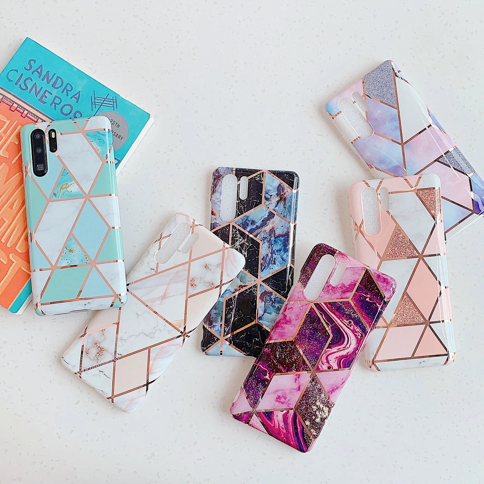 Electroplated marble pattern TPU back cover case for a Huawei or Samsung smartphone.