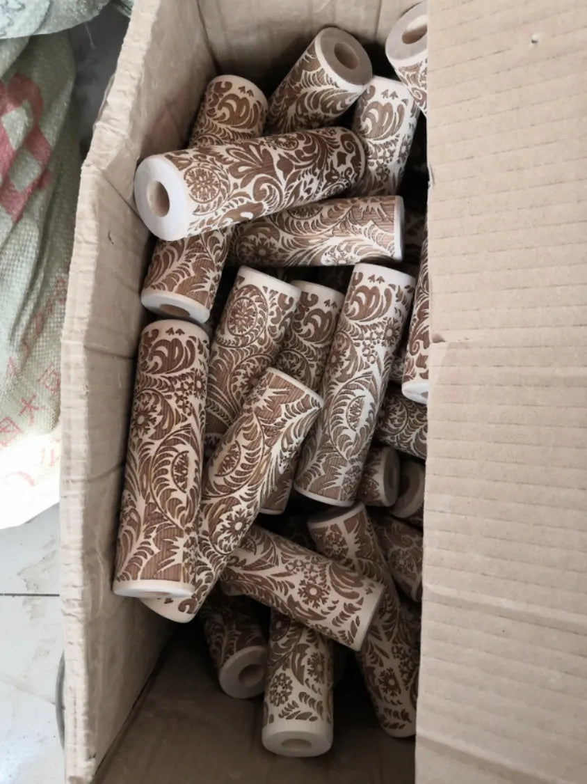 Wooden rolling pin with embossed Christmas snowflake pattern, 45 cm long.