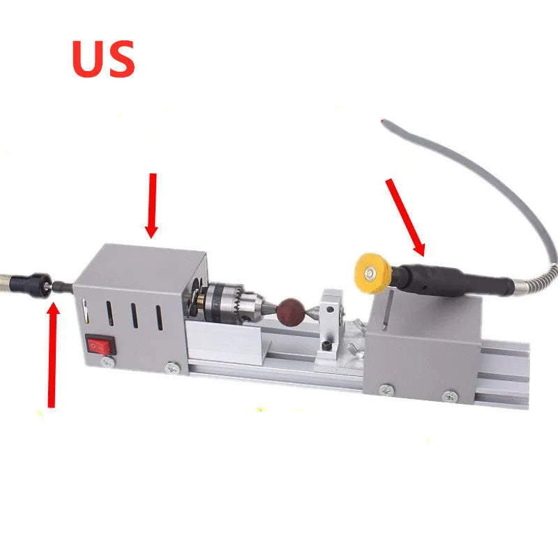 Mini metal woodworking lathe with carving knives and accessories on workbench