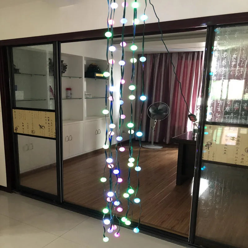 64-LED Christmas tree light string with colour-changing bulbs and integrated control button, 1.8 metres long with IP44 weather resistance