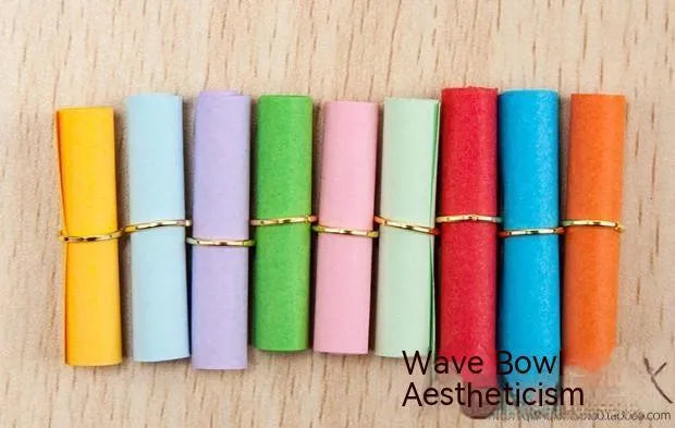 Colourful mini letter paper scrolls with eyelet holes for bottle messages in multiple sizes