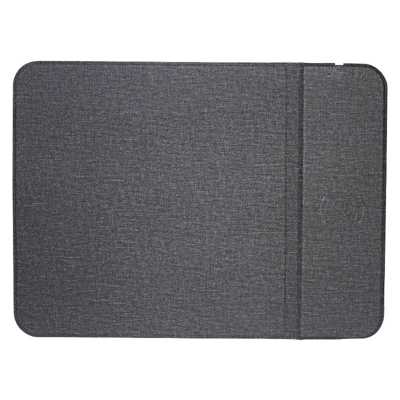 Black foldable fabric wireless charging phone holder standing upright on a desk.