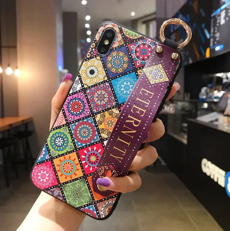 Samsung Galaxy phone case with folding bracket extended, showing floral pattern design