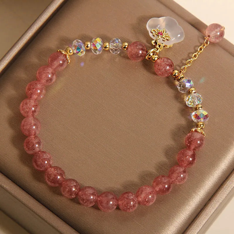 Women's adjustable crystal bracelet with strawberry quartz and white agate beads featuring auspicious cloud charm