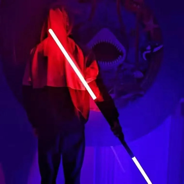 Two 2-in-1 RGB metal lightsabers connected with adapter showing ten-colour glow and metal hilt on blue background