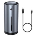 Black aluminium alloy car humidifier with USB cable and 12V car adapter plug on a desk.