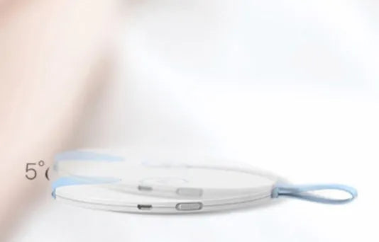 Slim blue portable UV baby bottle steriliser with USB port shown next to a baby bottle.