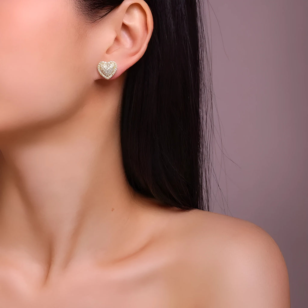 Gold tone heart-shaped stud earrings with clear moissanite stone on S925 silver base