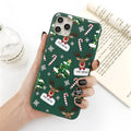 Green TPU iPhone case with a cartoon Christmas elk and tree design and stripe pattern.