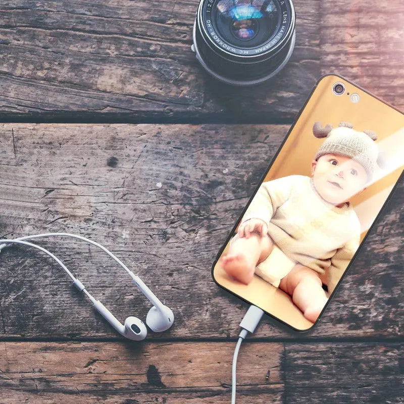Patterned ultra-thin iPhone case with raised camera bumper edge on a table.
