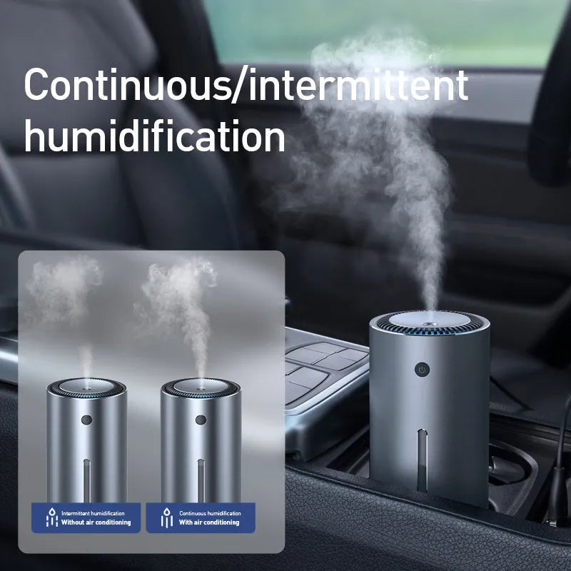 Black aluminium alloy car humidifier with USB cable and 12V car adapter plug on a desk.