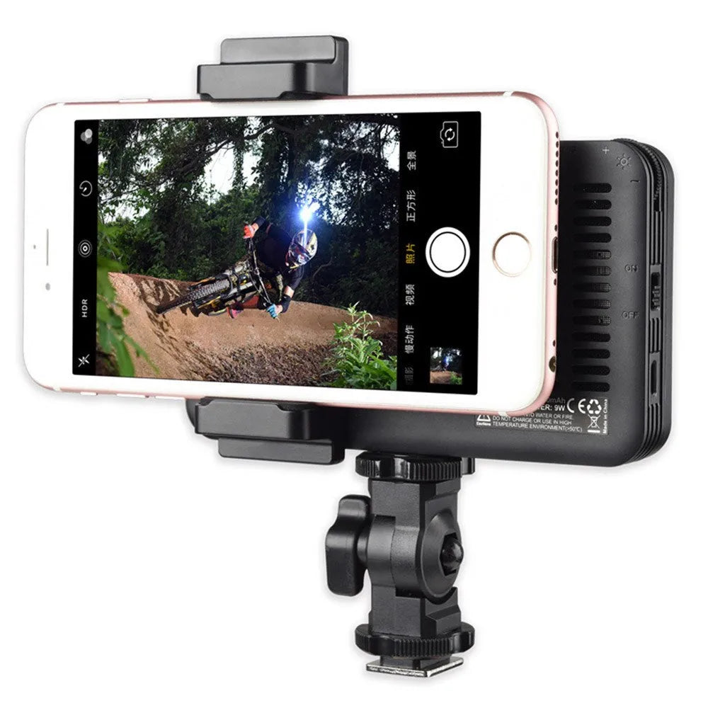 Shenniu M150 ultra-thin silver mobile phone LED video light with 150 LEDs, shown next to a smartphone.