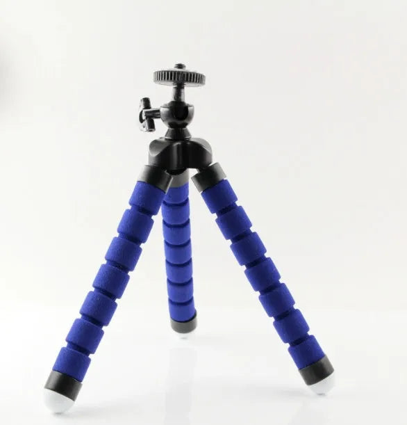 Black flexible octopus tripod with bent legs wrapped around a pole, showing a smartphone attached.