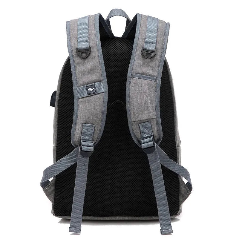 Canvas backpack with external USB charging port showing coffee colour option with multiple compartments.