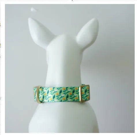 Nylon ribbon pet collar with floral pattern in Hanada blue colour, showing adjustable sizing and flower decoration