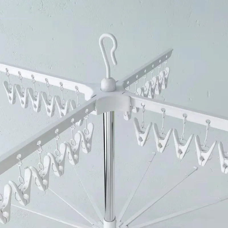 Mobile three-layer stainless steel drying rack with plastic clips and dedicated garment sections