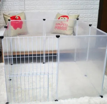 Pet transparent fence with six clear plastic panels arranged as a barrier on a wooden floor, showing interlocking connectors