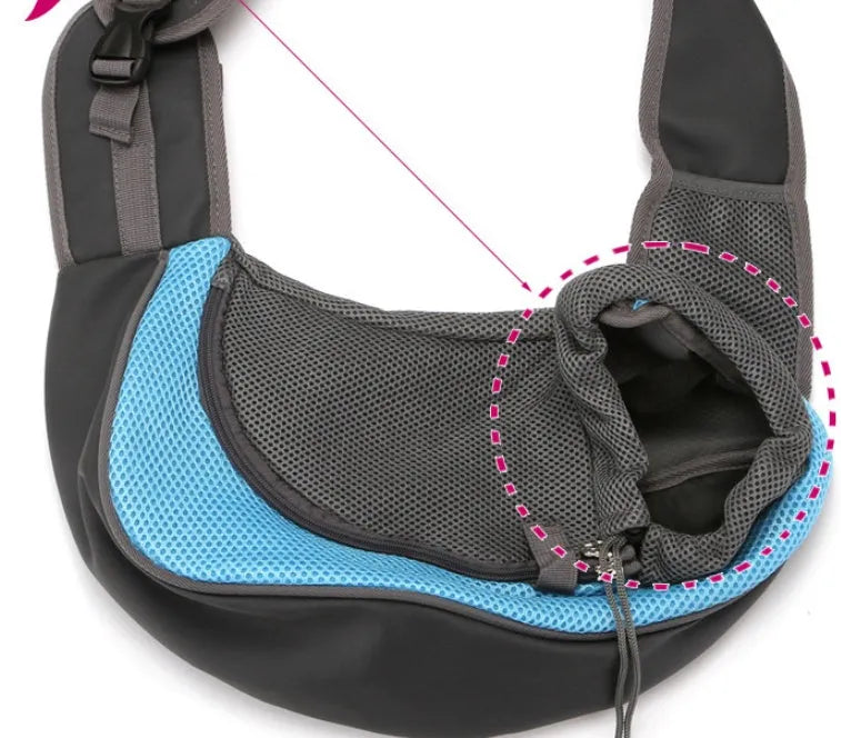 Blue pet carrier backpack for a small dog, showing padded interior and shoulder straps.
