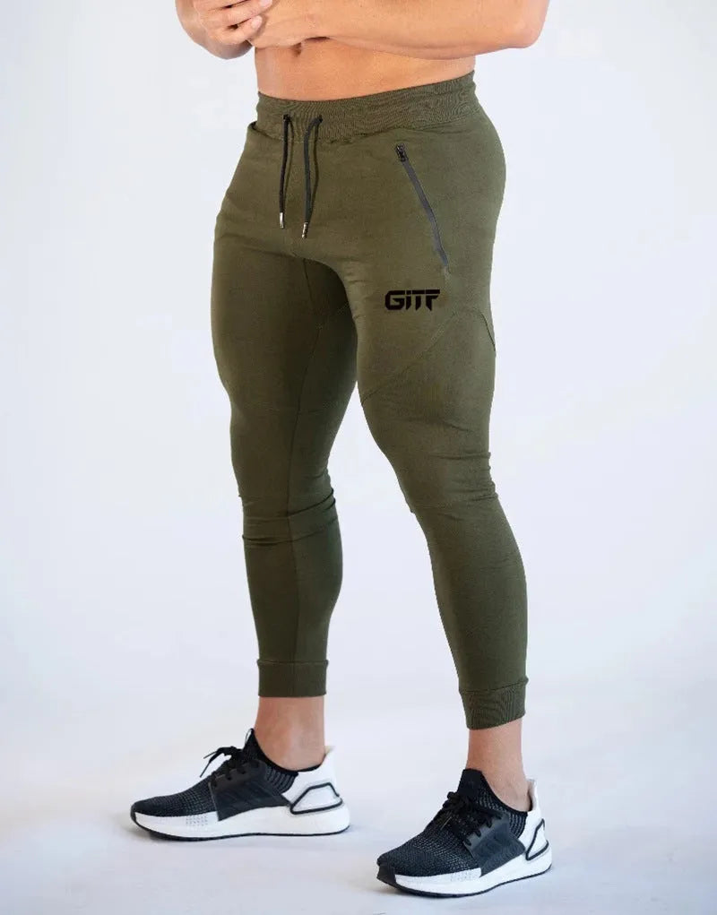 Men's camouflage quick dry jogging trousers in slim fit style from front view on plain background