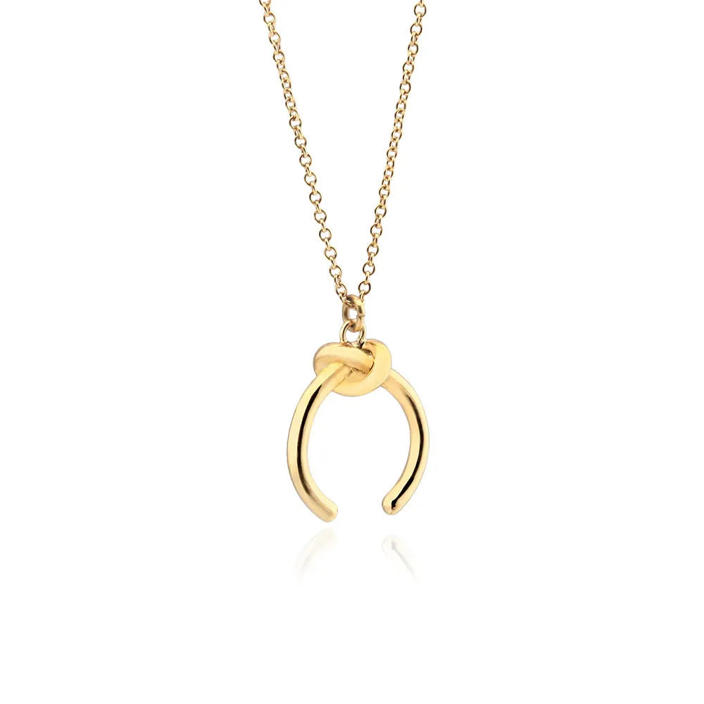 Vintage-style geometric copper pendant necklace on an adjustable cross chain in gold colour.