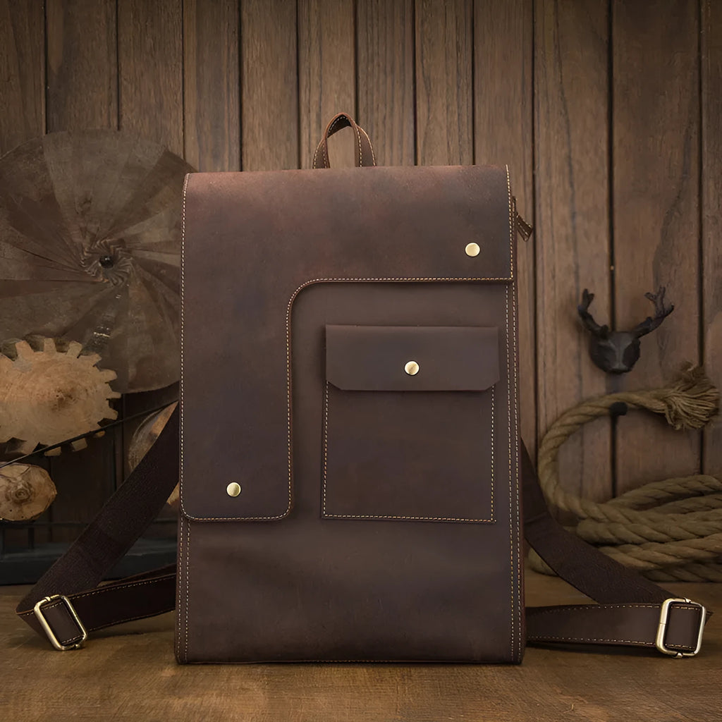 Dark brown genuine leather travel bag with shoulder straps and organised internal compartments