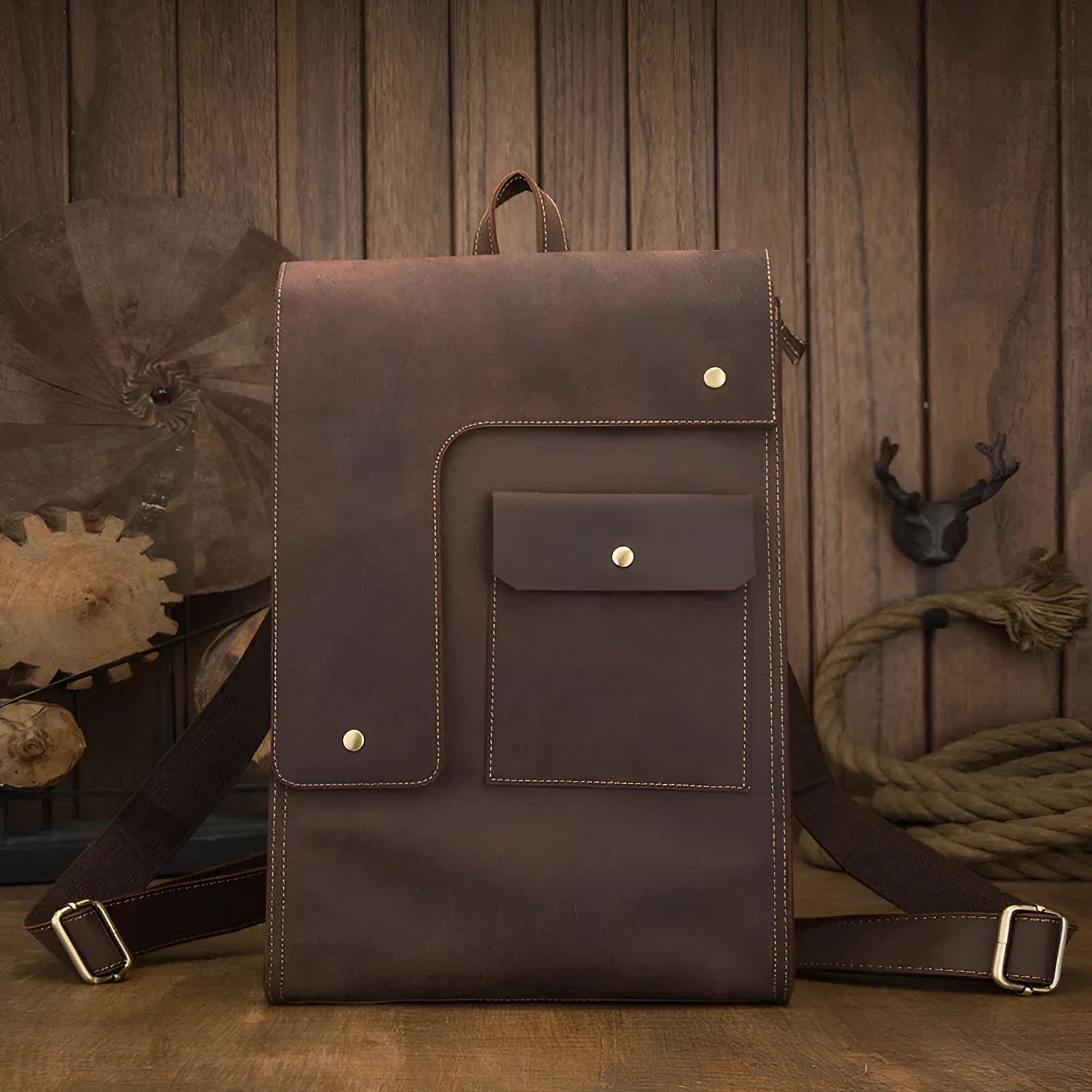Dark brown genuine leather travel bag with shoulder straps and organised internal compartments