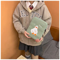 Blue cotton tablet case with embroidered cartoon duck design and a black zipper, shown open.