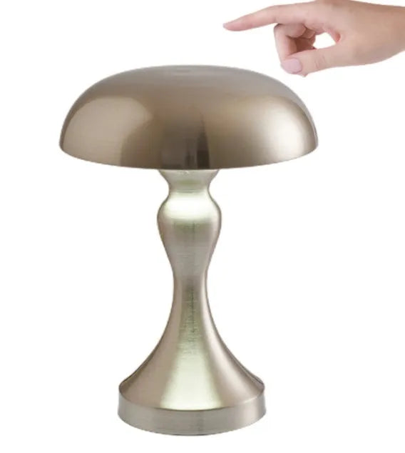 Metallic bronze touch-control LED desk lamp showing tri-colour light settings on a wooden desk.